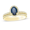 Thumbnail Image 0 of Oval Sapphire and 0.33 CT. T.W. Diamond Frame Bridal Set in 14K Gold