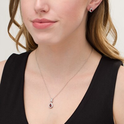 Pear-Shaped Garnet and Diamond Accent Teardrop Frame Pendant and Stud Earrings Set in Sterling Silver