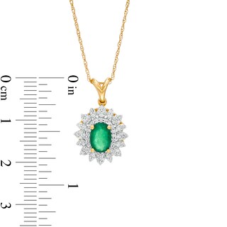 Oval Emerald and 0.20 CT. T.W. Diamond Flower Frame Pendant in 10K Gold