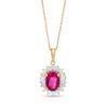 Oval Ruby and 0.20 CT. T.W. Baguette and Round Diamond Starburst Frame Pendant in 10K Gold