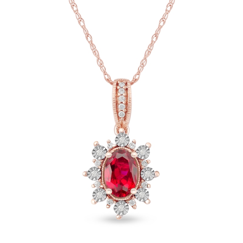 Oval Ruby and 0.08 CT. T.W. Diamond Sunburst Frame Vintage-Style Drop Pendant in 10K Rose Gold|Peoples Jewellers