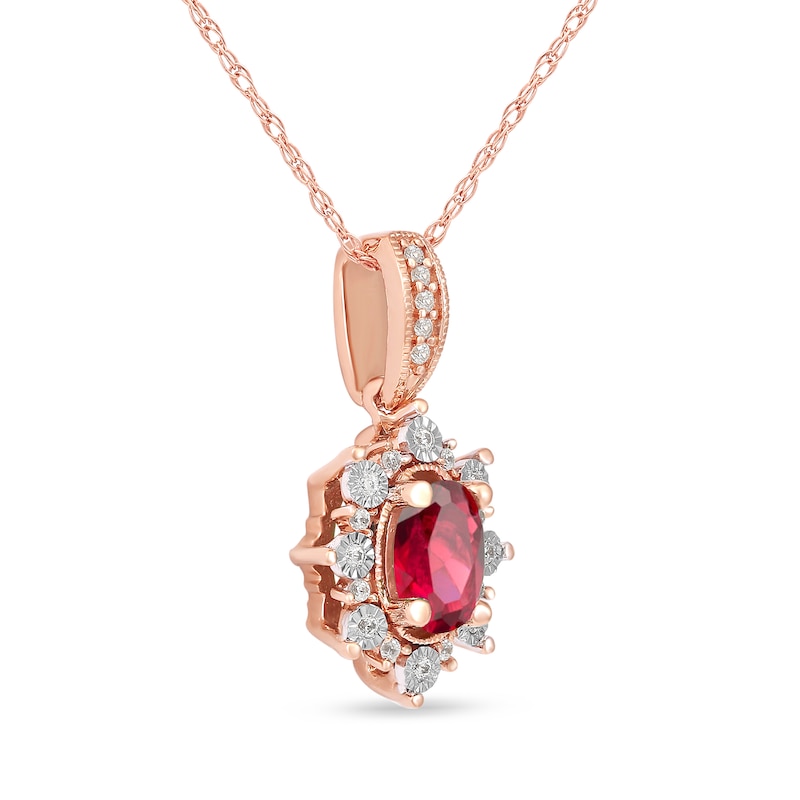 Oval Ruby and 0.08 CT. T.W. Diamond Sunburst Frame Vintage-Style Drop Pendant in 10K Rose Gold