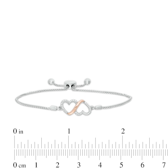 0.10 CT. T.W. Diamond Double Heart Loop Bolo Bracelet in Sterling Silver and 10K Rose Gold - 9.50"