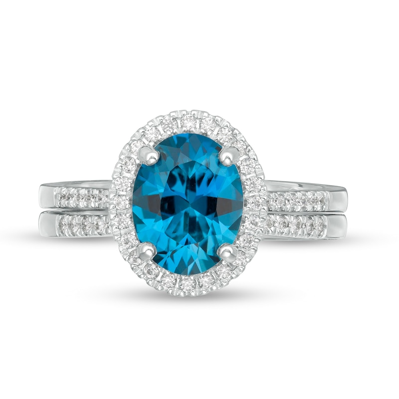 Oval London Blue Topaz and 0.31 CT. T.W. Diamond Frame Bridal Set in 14K White Gold