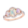 Oval Cabochon Opal and 0.31 CT. T.W. Diamond Frame Three Stone Twist Shank Ring in 10K Rose Gold