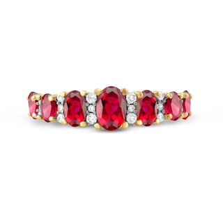 Oval Ruby and 0.15 CT. T.W. Diamond Graduated Seven Stone Alternating Trios Ring in 10K Gold