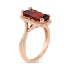 Emerald-Cut Garnet and 0.25 CT. T.W. Diamond Octagonal Frame Crossover Shank Ring in 10K Rose Gold