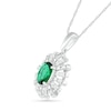 Oval Lab-Created Emerald and 0.066 CT. T.W. Diamond Starburst Frame Pendant in Sterling Silver