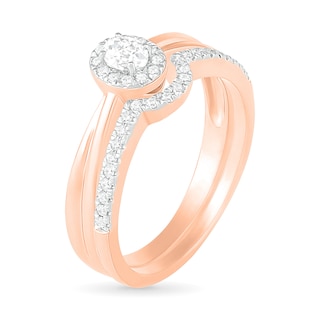 0.29 CT. T.W. Oval Diamond Frame Bridal Set in 10K Rose Gold