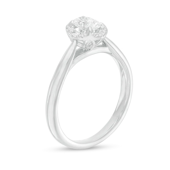 0.62 CT. T.W. Oval Diamond Frame Engagement Ring in 14K White Gold (I/I2)