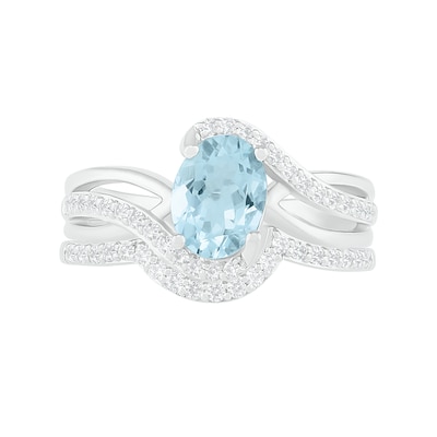 Oval Aquamarine and 0.086 CT. T.W. Diamond Bypass Split Shank Bridal Set in Sterling Silver