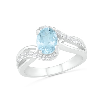 Oval Aquamarine and 0.086 CT. T.W. Diamond Bypass Split Shank Bridal Set in Sterling Silver