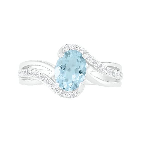 Oval Aquamarine and 0.086 CT. T.W. Diamond Bypass Split Shank Bridal Set in Sterling Silver