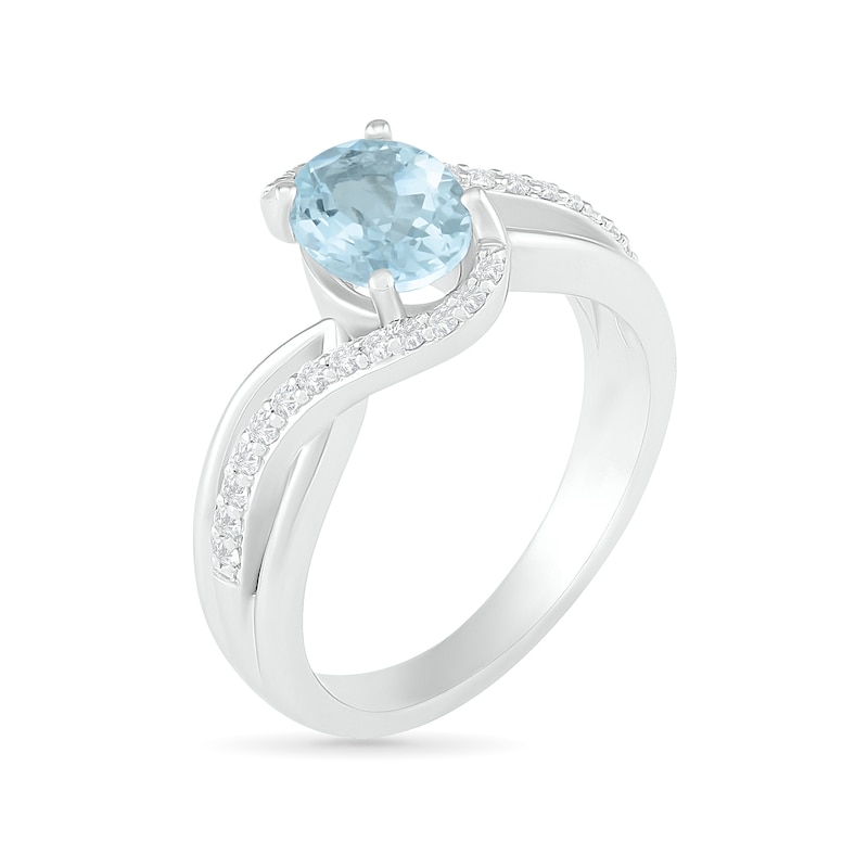 Oval Aquamarine and 0.086 CT. T.W. Diamond Bypass Split Shank Bridal Set in Sterling Silver