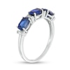 Oval Lab-Created Blue Sapphire and Baguette Diamond Accent Three Stone Ring in Sterling Silver