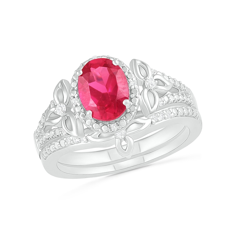 Oval Lab-Created Ruby and 0.065 CT. T.W. Diamond Bead Frame Flower-Sides Split Shank Bridal Set in Sterling Silver|Peoples Jewellers