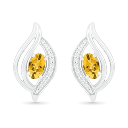 Oval Citrine and 0.04 CT. T.W. Diamond Bypass Flame Stud Earrings in Sterling Silver