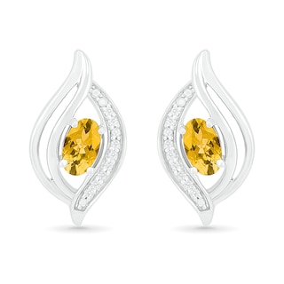 Oval Citrine and 0.04 CT. T.W. Diamond Bypass Flame Stud Earrings in Sterling Silver