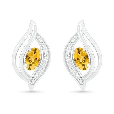 Oval Citrine and 0.04 CT. T.W. Diamond Bypass Flame Stud Earrings in Sterling Silver