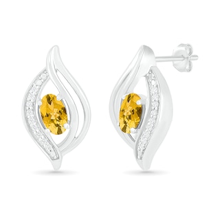 Oval Citrine and 0.04 CT. T.W. Diamond Bypass Flame Stud Earrings in Sterling Silver