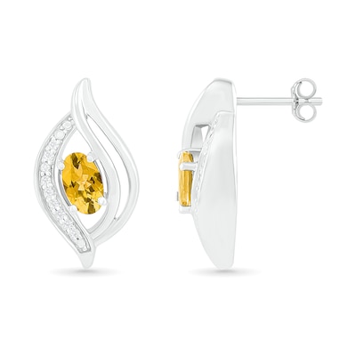 Oval Citrine and 0.04 CT. T.W. Diamond Bypass Flame Stud Earrings in Sterling Silver