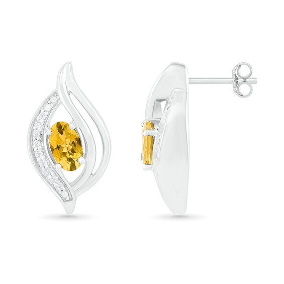 Oval Citrine and 0.04 CT. T.W. Diamond Bypass Flame Stud Earrings in Sterling Silver