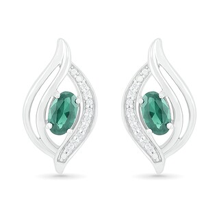 Oval Lab-Created Emerald and 0.04 CT. T.W. Diamond Bypass Flame Stud Earrings in Sterling Silver