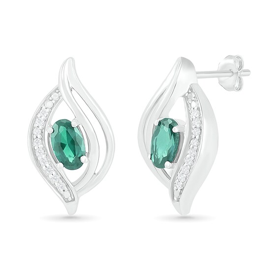 Oval Lab-Created Emerald and 0.04 CT. T.W. Diamond Bypass Flame Stud Earrings in Sterling Silver