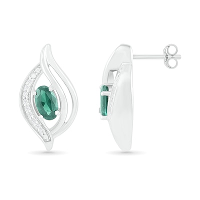 Oval Lab-Created Emerald and 0.04 CT. T.W. Diamond Bypass Flame Stud Earrings in Sterling Silver