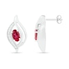 Oval Lab-Created Ruby and 0.04 CT. T.W. Diamond Bypass Flame Stud Earrings in Sterling Silver