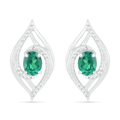 Lab-Created Oval Emerald and 0.067 CT. T.W. Diamond Bypass Flame Stud Earrings in Sterling Silver