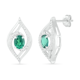 Lab-Created Oval Emerald and 0.067 CT. T.W. Diamond Bypass Flame Stud Earrings in Sterling Silver