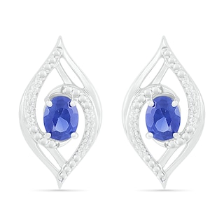 Oval Blue Lab-Created Sapphire and 0.067 CT. T.W. Diamond Bypass Flame Stud Earrings in Sterling Silver