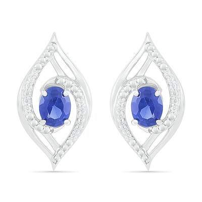 Oval Blue Lab-Created Sapphire and 0.067 CT. T.W. Diamond Bypass Flame Stud Earrings in Sterling Silver