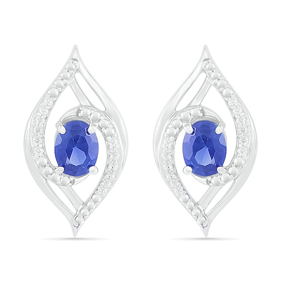 Oval Blue Lab-Created Sapphire and 0.067 CT. T.W. Diamond Bypass Flame Stud Earrings in Sterling Silver