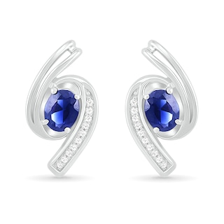 Oval Blue Lab-Created Sapphire and 0.04 CT. T.W. Diamond Bypass Ribbon Stud Earrings in Sterling Silver