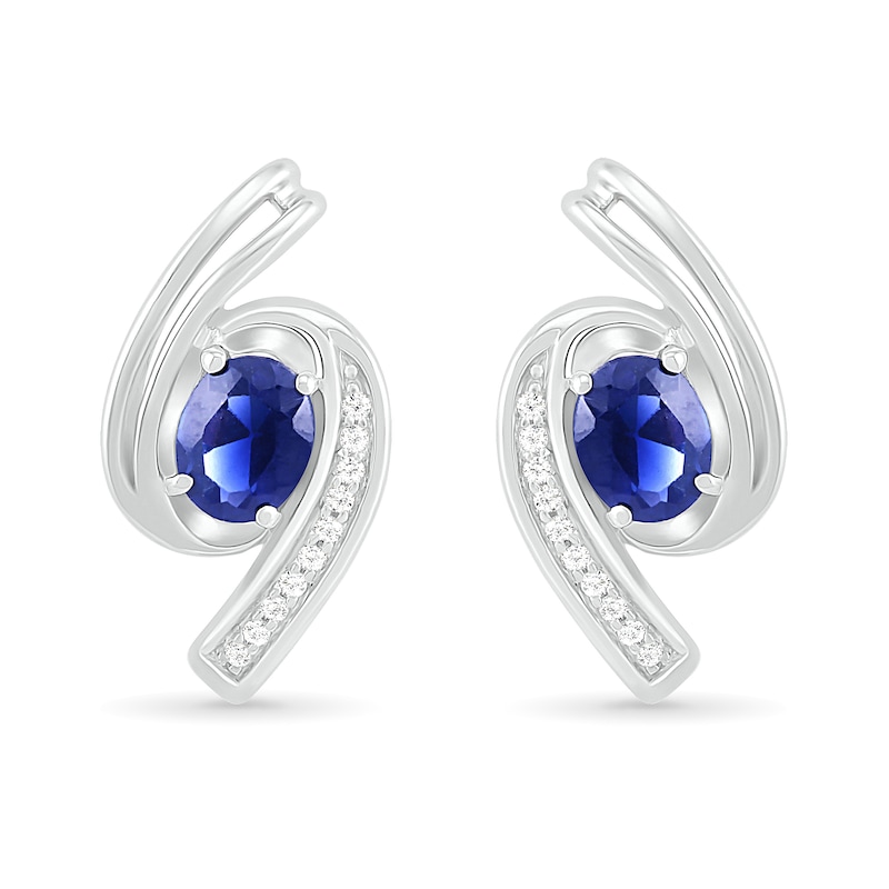 Main Image 1 of Oval Blue Lab-Created Sapphire and 0.04 CT. T.W. Diamond Bypass Ribbon Stud Earrings in Sterling Silver