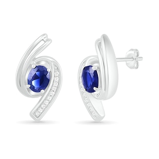 Oval Blue Lab-Created Sapphire and 0.04 CT. T.W. Diamond Bypass Ribbon Stud Earrings in Sterling Silver