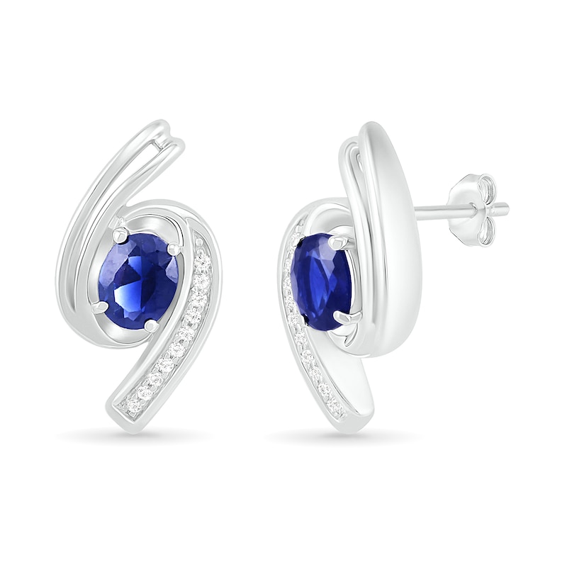 Main Image 2 of Oval Blue Lab-Created Sapphire and 0.04 CT. T.W. Diamond Bypass Ribbon Stud Earrings in Sterling Silver