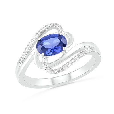 Sideways Blue Lab-Created Sapphire and 0.068 CT. T.W. Diamond Ribbon Bypass Ring in Sterling Silver