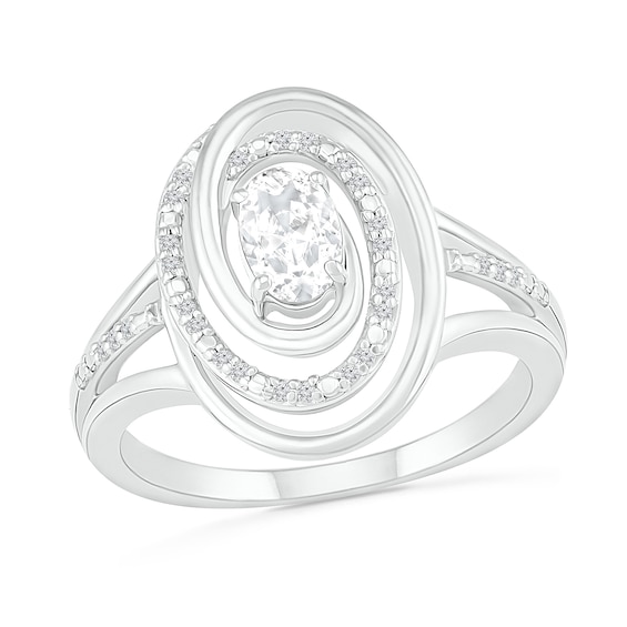 Oval White Lab-Created Sapphire and 0.065 CT. T.W. Diamond Swirl Frame Triple Row Split Shank Ring in Sterling Silver