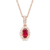 Oval Ruby and 0.06 CT. T.W. Diamond Framed Vintage-Style Drop Pendant in 10K Rose Gold