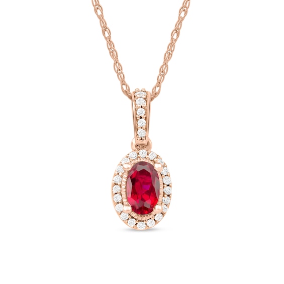 Oval Ruby and 0.06 CT. T.W. Diamond Framed Vintage-Style Drop Pendant in 10K Rose Gold