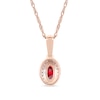 Oval Ruby and 0.06 CT. T.W. Diamond Framed Vintage-Style Drop Pendant in 10K Rose Gold