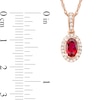 Oval Ruby and 0.06 CT. T.W. Diamond Framed Vintage-Style Drop Pendant in 10K Rose Gold