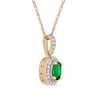 Oval Emerald and 0.06 CT. T.W. Diamond Framed Vintage-Style Drop Pendant in 10K Gold