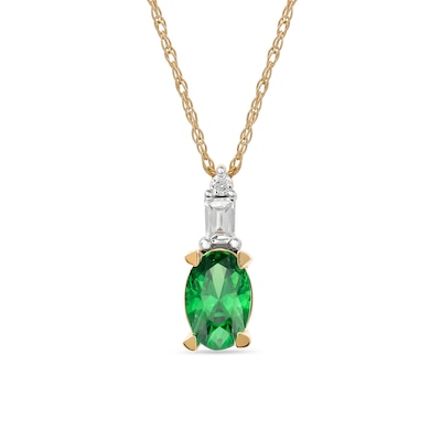 Oval Emerald and 0.05 CT. T.W. Baguette and Round Diamond Stacked Top Accent Pendant in 10K Gold