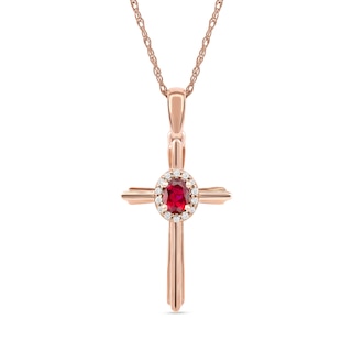 Oval Ruby and 0.04 CT. T.W. Diamond Frame Layered Cross Pendant in 10K Rose Gold