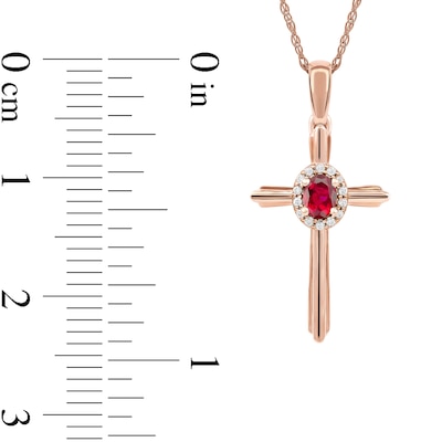 Oval Ruby and 0.04 CT. T.W. Diamond Frame Layered Cross Pendant in 10K Rose Gold