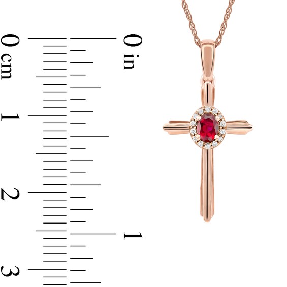 Oval Ruby and 0.04 CT. T.W. Diamond Frame Layered Cross Pendant in 10K Rose Gold